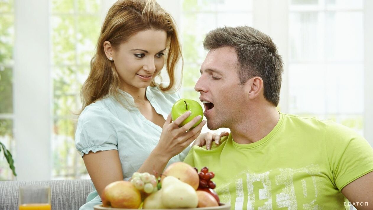 girl feeding man healthy food